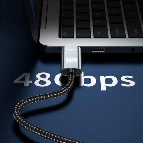 A laptop with a usb cable attached to it