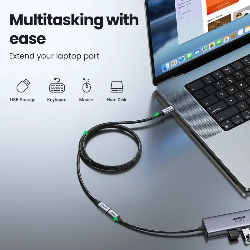 A laptop with a usb cable attached to it