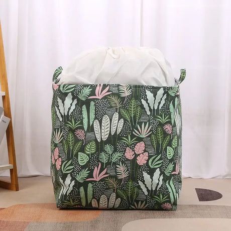 a large bag with a pattern of plants and leaves