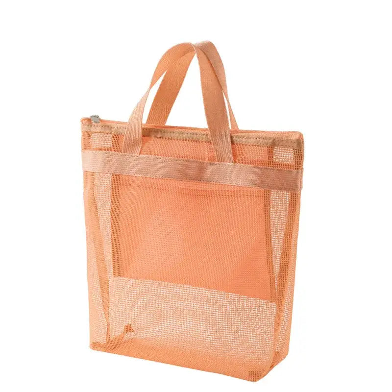 a large orange mesh bag with a handle