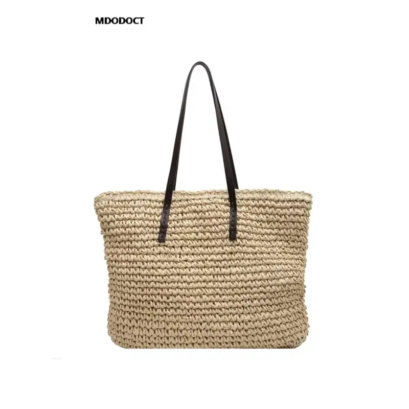 a large straw bag with a black handle