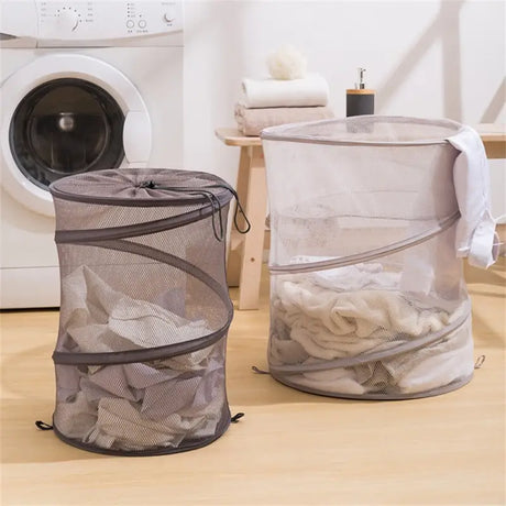 two laundry bags sitting on a wooden floor
