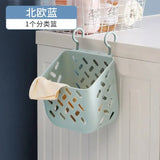 a laundry basket hanging on the wall above the wash basin