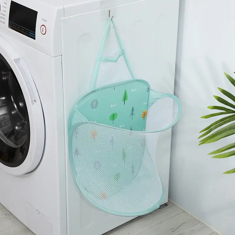 a laundry basket hanging on the side of a washing machine