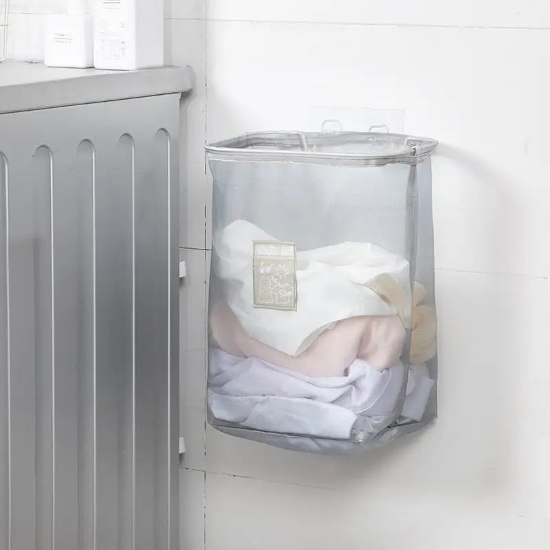 a baby is sleeping in a laundry basket