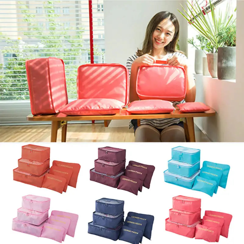 a woman sitting on a bench with several different colors of bags