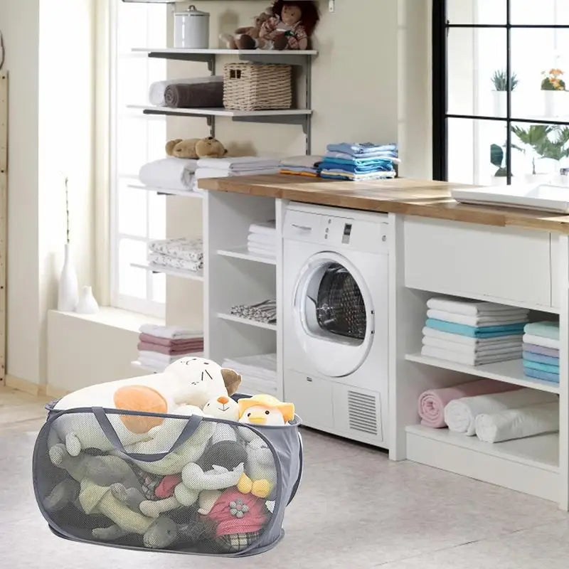 a laundry room with a washing machine and a laundry basket