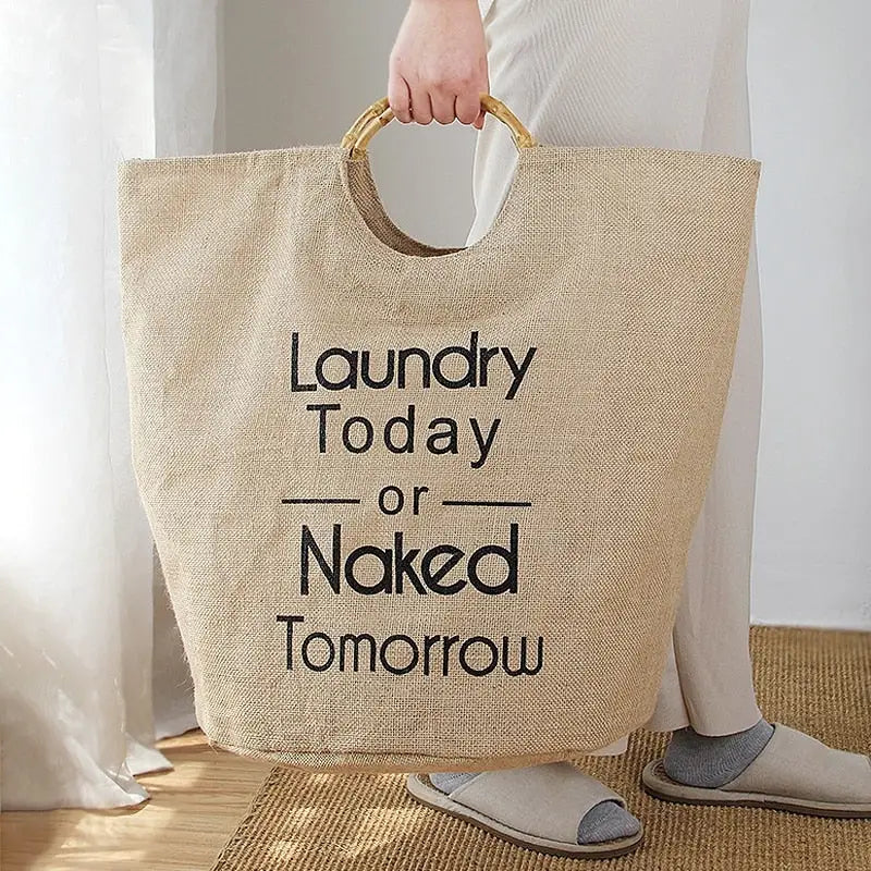 a person holding a bag with the words laundry to day
