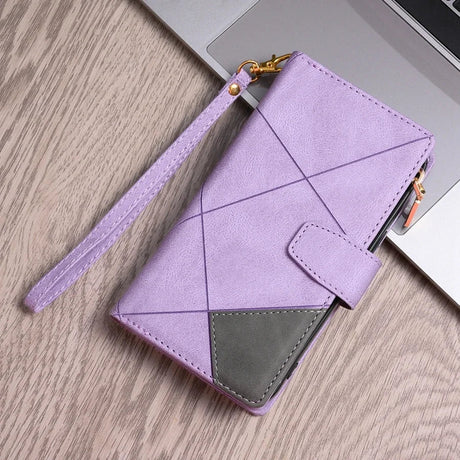 Lavender-colored wallet with geometric stitching and a wrist strap.