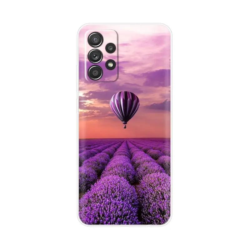 a lavender field with a hot air balloon in the sky