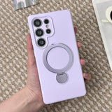 A lavender phone case with a silver ring holder.