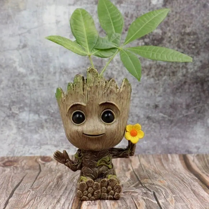 a close up of a small toy with a plant in it