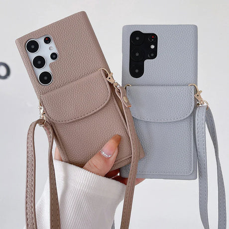 Leather phone cases with crossbody straps and camera cutouts.