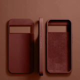 Leather phone cases or wallet covers in a reddish-brown color.