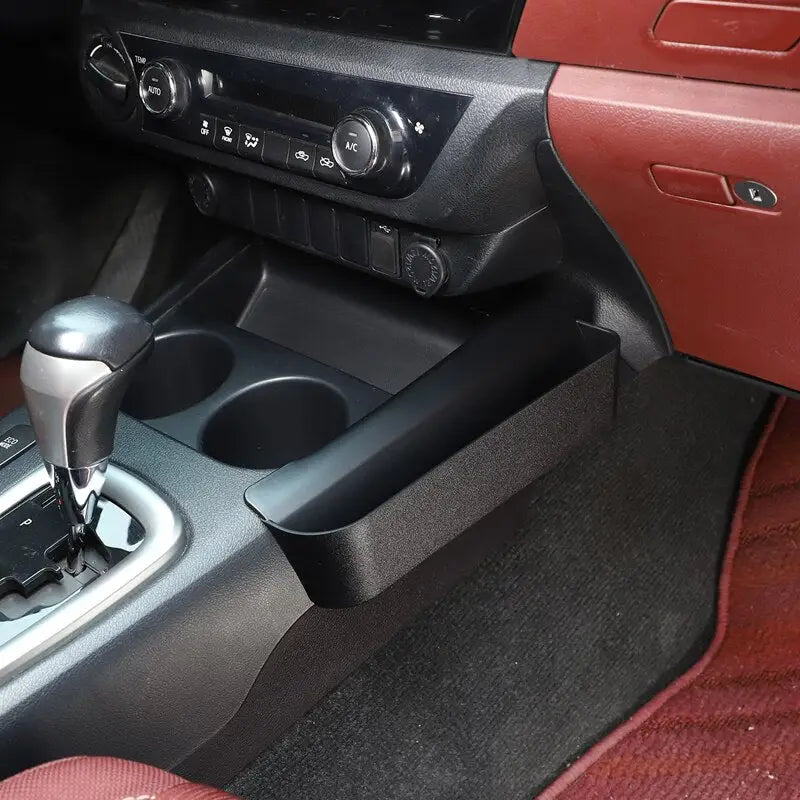 the interior of a car with a red leather seat