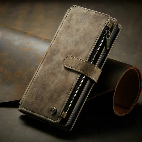 Leather wallet with a zipper compartment and snap closure.