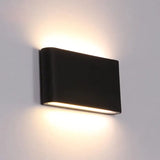 a black wall light with a white light