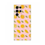 a pink phone case with lemons and leaves