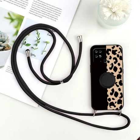 a black and white phone case with a black strap