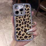 Leopard print phone case with a diamond-studded border.