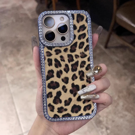 Leopard print phone case with a diamond-studded border.