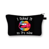 a black zipper bag with a colorful lip on it