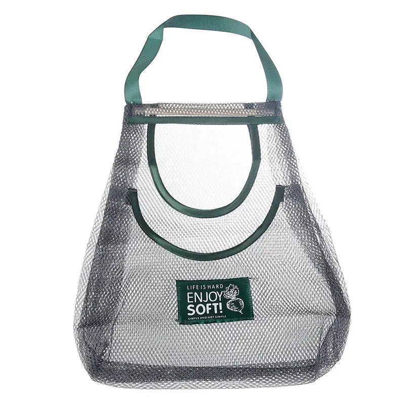 a mesh bag with a green handle