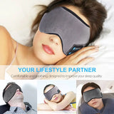 a woman sleeping in bed with a sleep mask