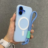 Light blue iPhone case with a white magnetic ring, a matching wrist strap, and a clear protective bumper.