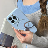 Light blue phone case with a circular magnetic stand and ring holder.