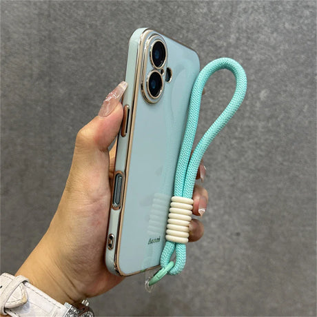 Light blue phone case with a mint green wrist strap.
