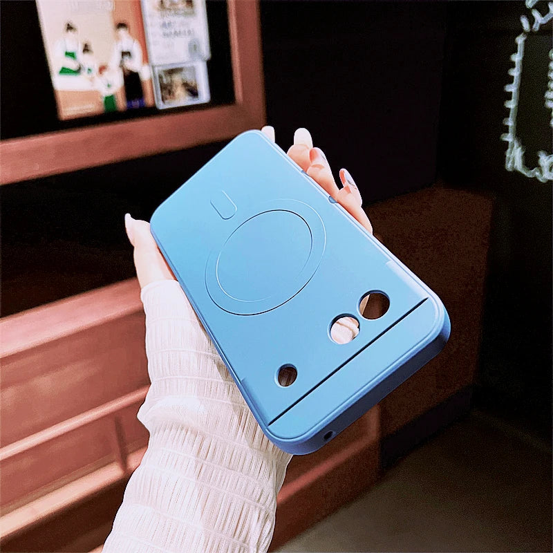 Light blue smartphone case with cat ear-like protrusions and a circular design.