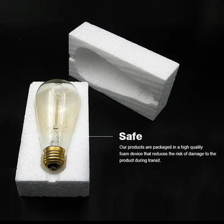 A light bulb sitting on top of a block of white foam