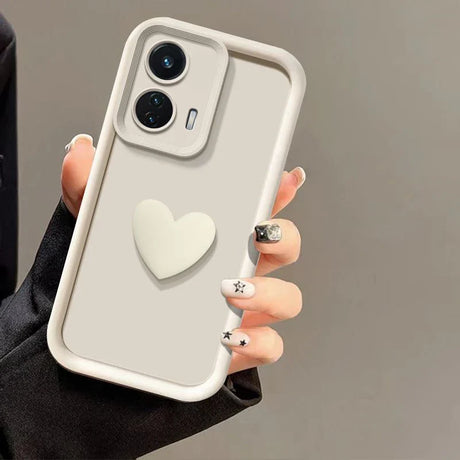 A light gray phone case with a raised heart design and a contrasting white border.