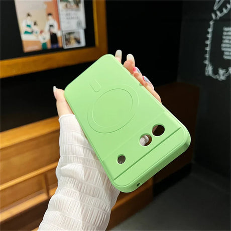 Light green phone case with a cute frog-like design featuring eyes and a smile.