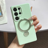 Light green phone case with a built-in silver ring holder.