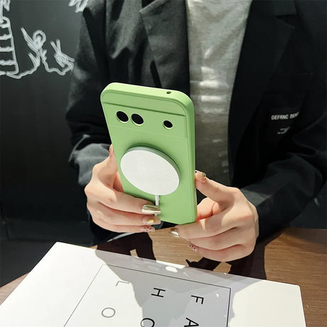 Light green smartphone case with a circular cutout and two camera holes.