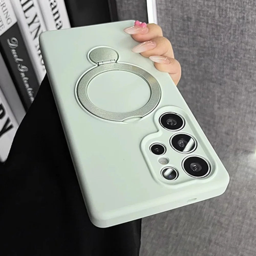 Light green smartphone case with a built-in silver ring holder.