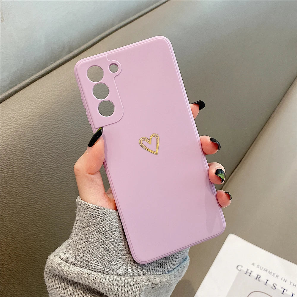 Light purple phone case with a gold heart design.