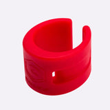 a red plastic bracelet with a hole in the middle