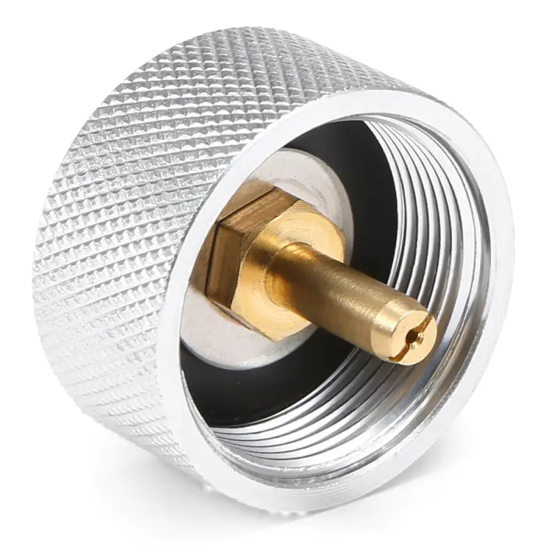 a chrome and black knob with a brass fitting