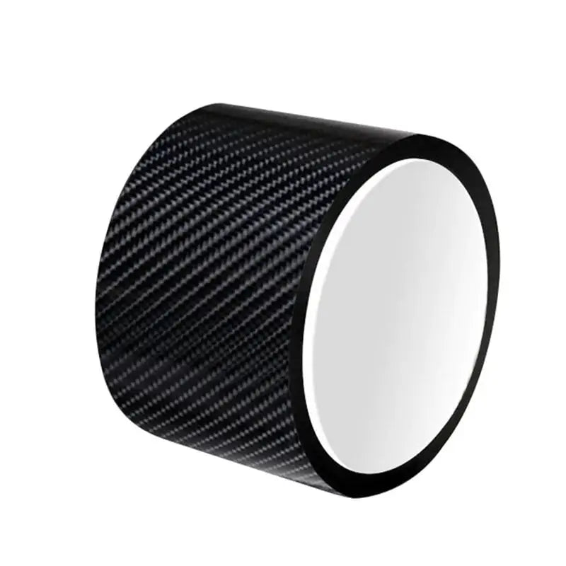 a close up of a black and white carbon fiber tape