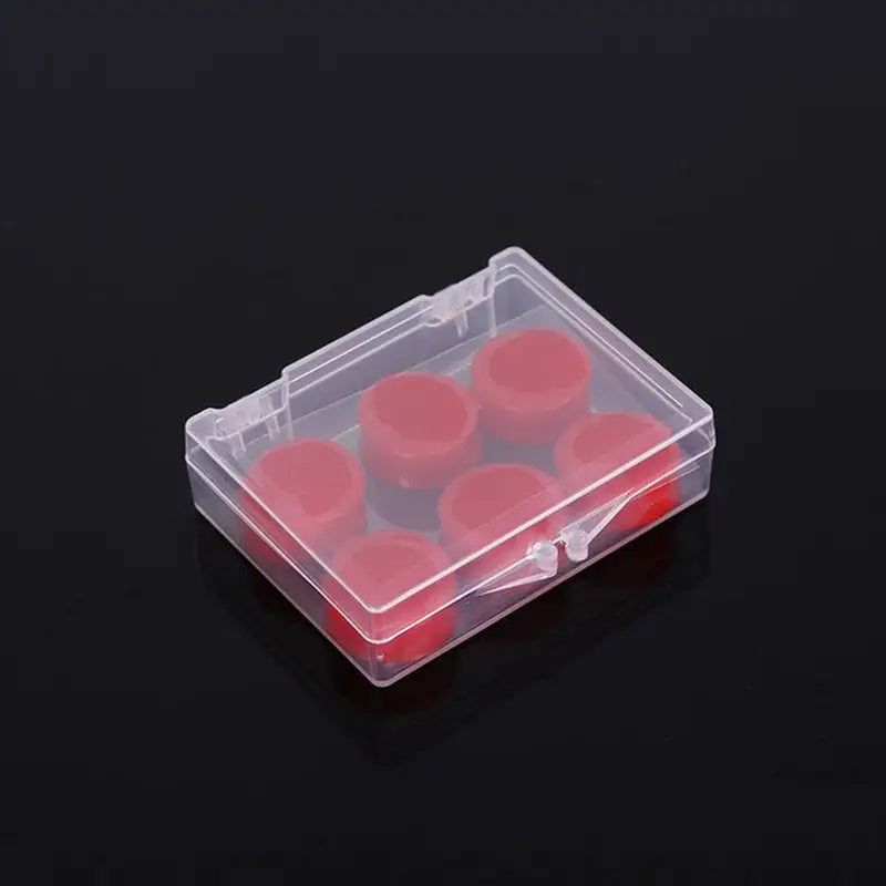 a clear plastic box with red plastic buttons