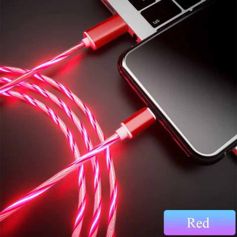 a red cable connected to a laptop