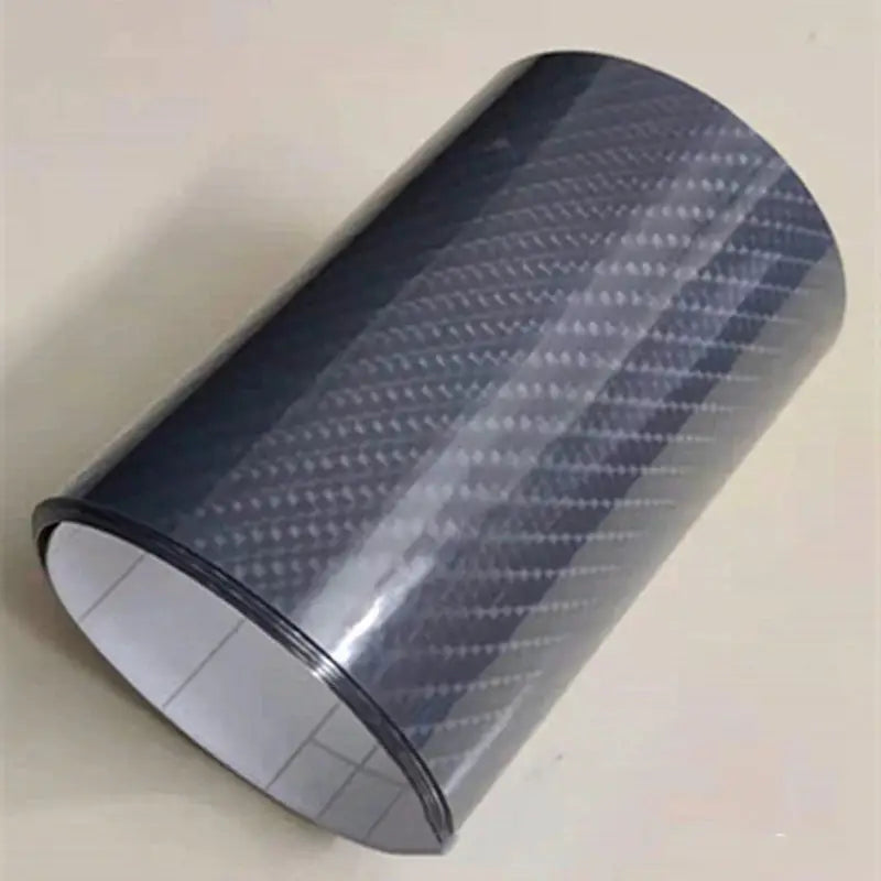 a close up of a roll of black carbon fiber