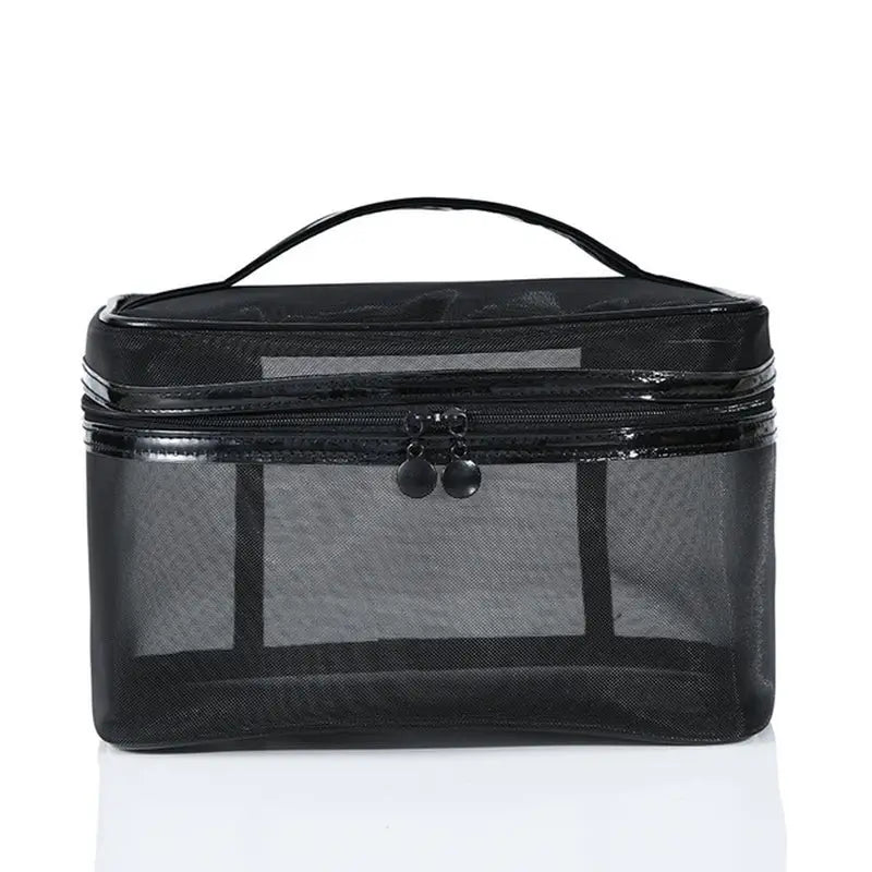 the black cosmetic bag is a large, clear, cosmetic bag with a zipper closure