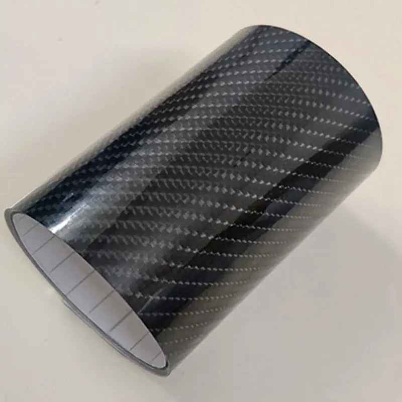 a close up of a roll of black carbon fiber
