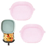 two pink plastic bowls with lids and lids
