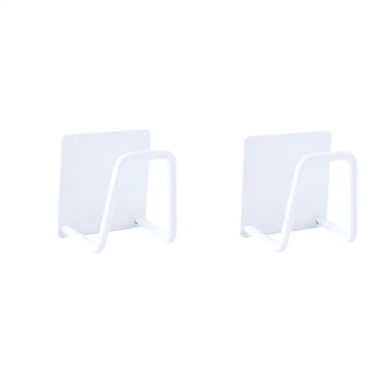 a pair of white plastic wall hooks