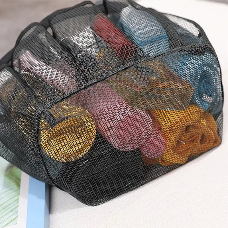 a mesh bag filled with various colored plastic bottles